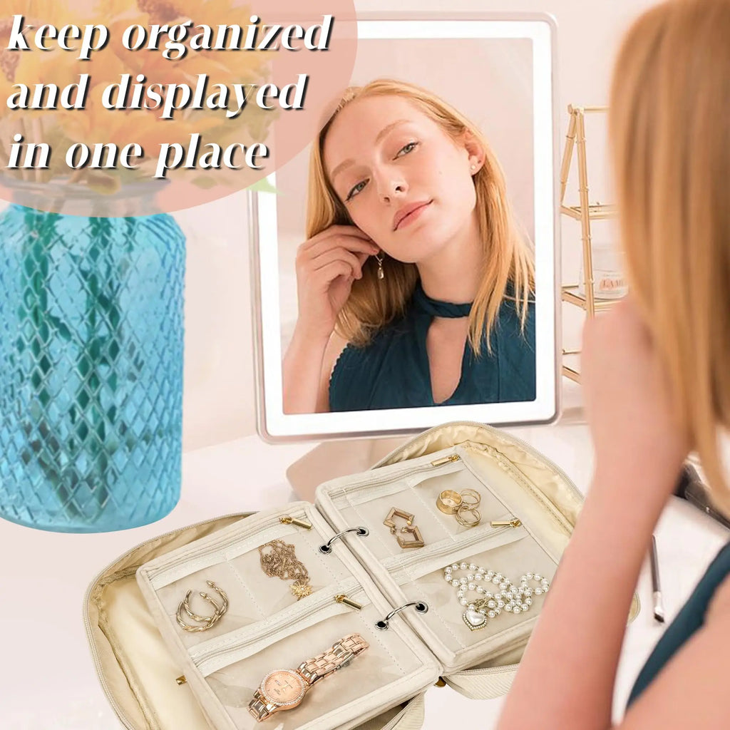 Jewelry binder open on a dresser with rings, watches and necklaces on display